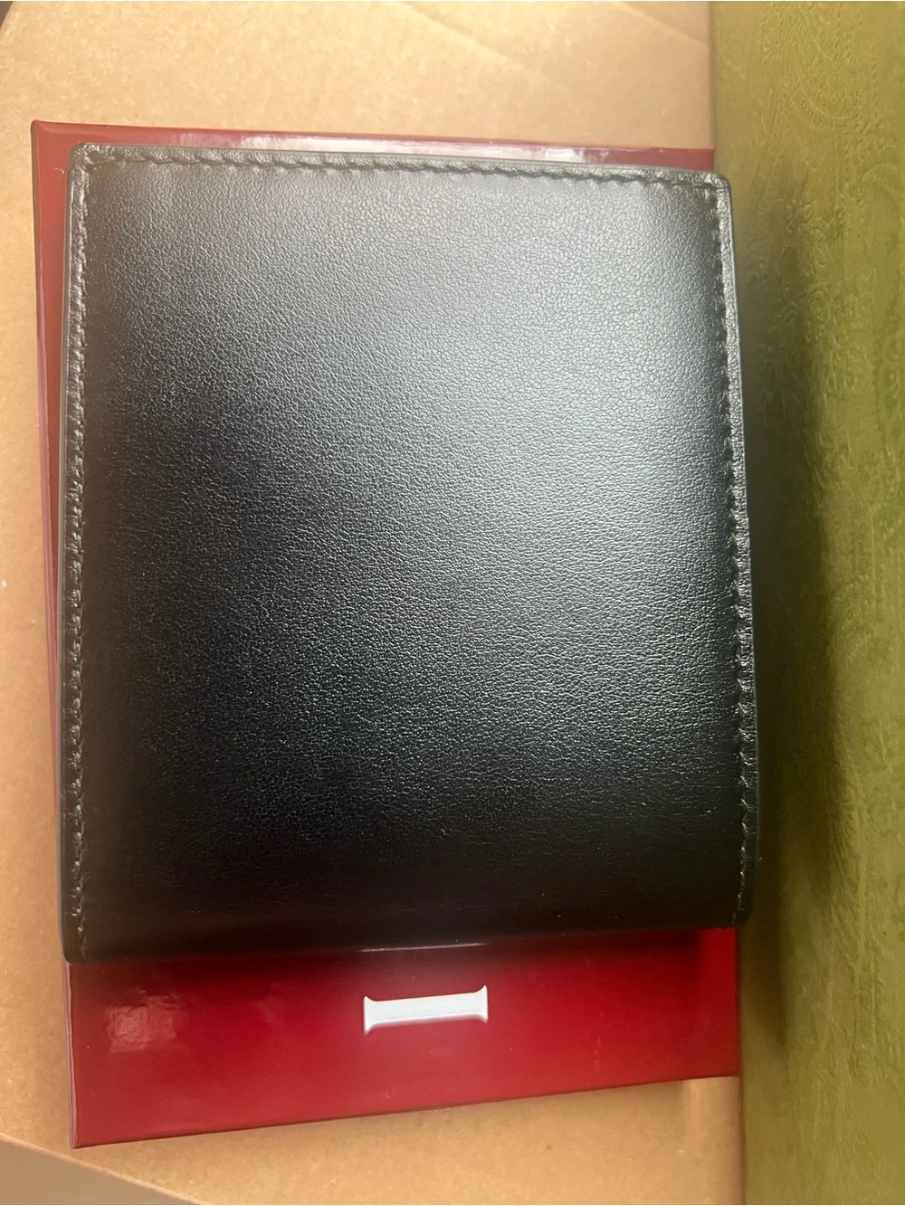 Gucci Black Leather Bifold Wallet with Gold Logo Accent